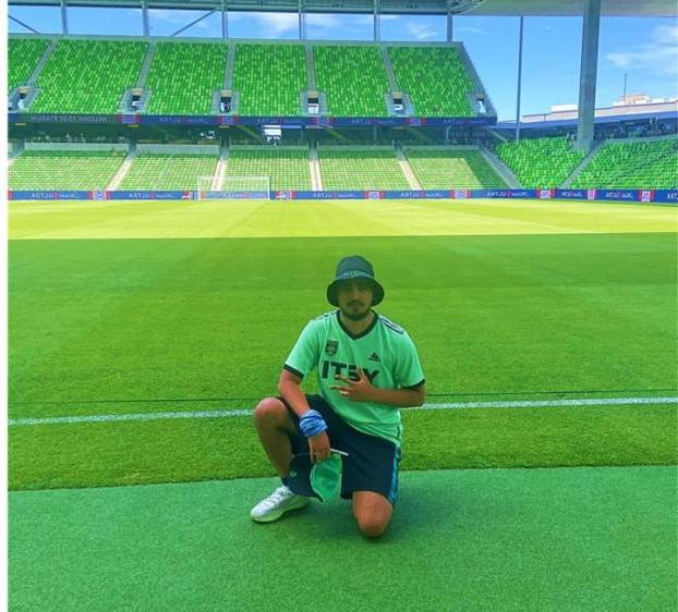 Ruben Valdovinos poses on the Austin FC field.