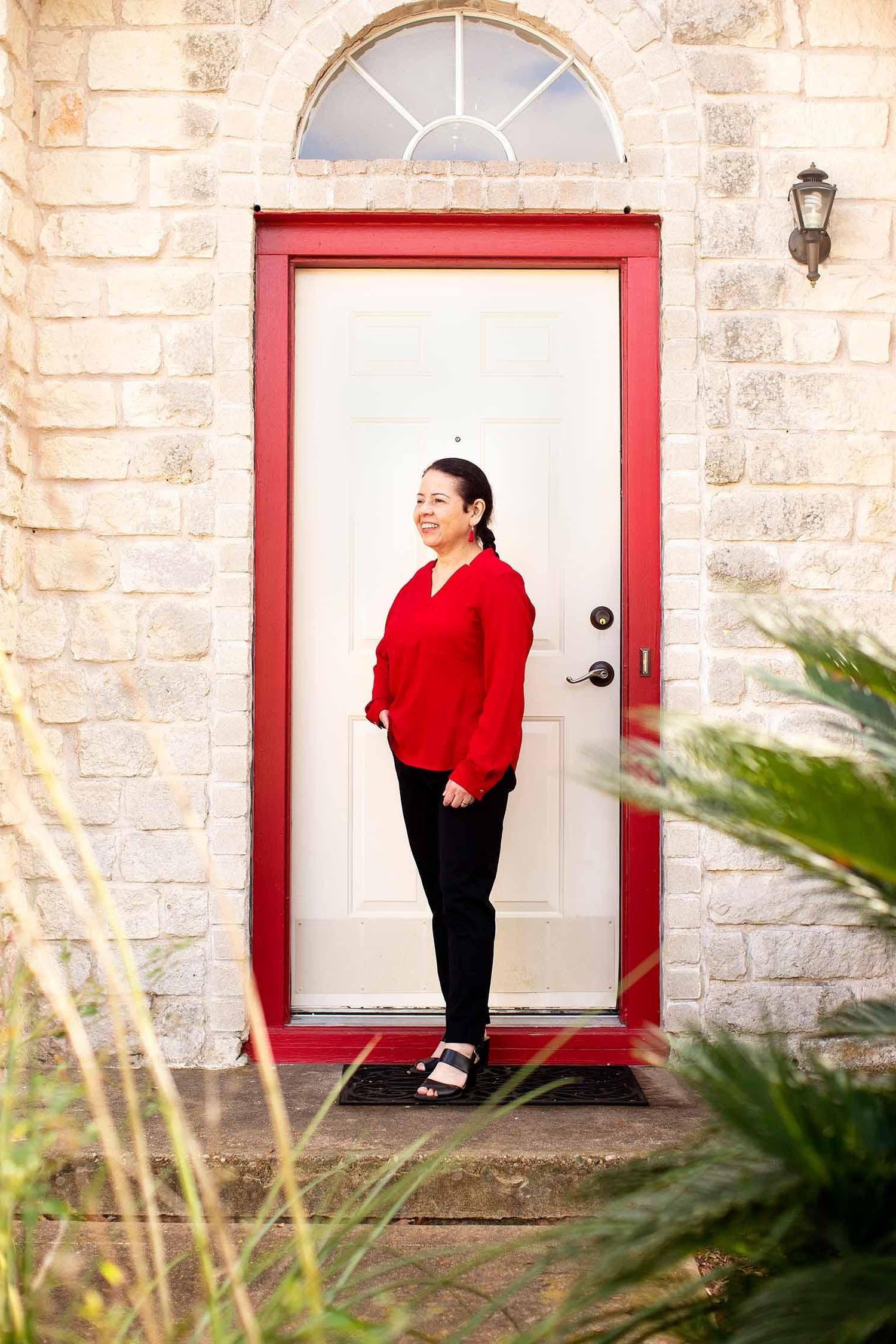 Tere Garza standing in front of door